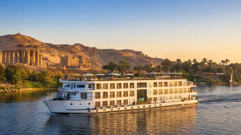 A Nile cruise ship at golden hour near Luxor